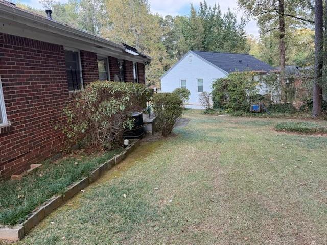 1529 North Columbia Place Decatur, GA 30032 - Photo 8 of 21 a backyard of a house with lots of green space