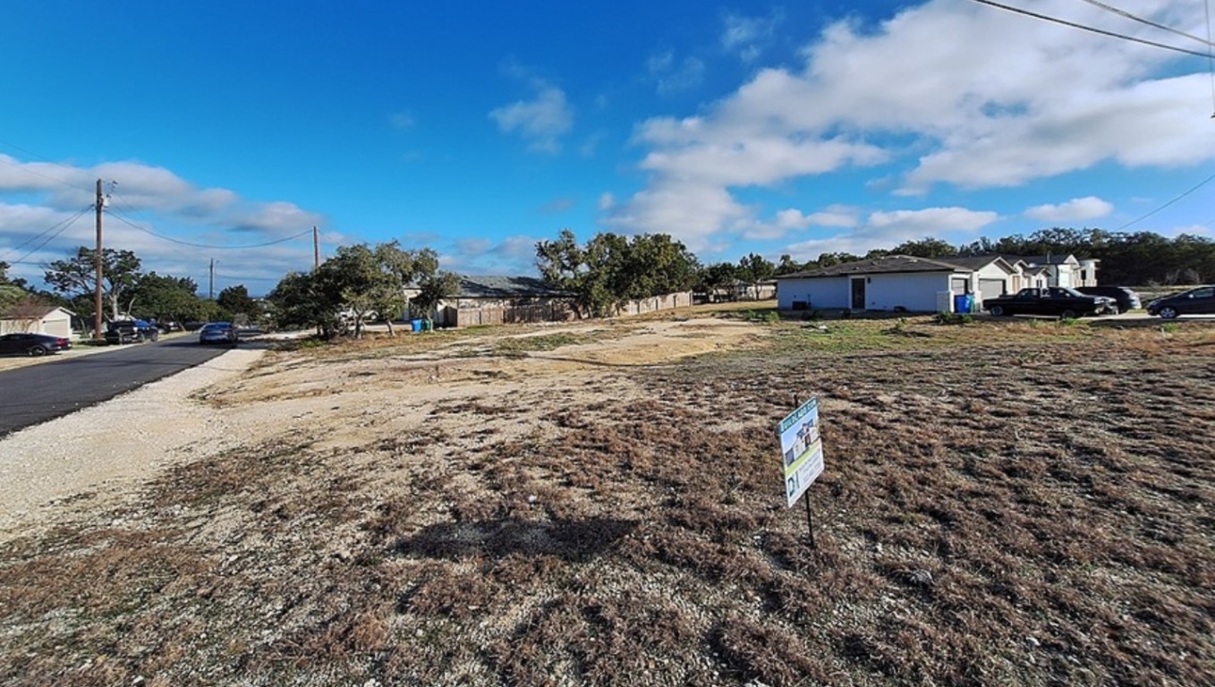 20014 Boggy Ford Road Lago Vista, TX 78645 - Photo 3 of 5 a view of a dirt road and a building