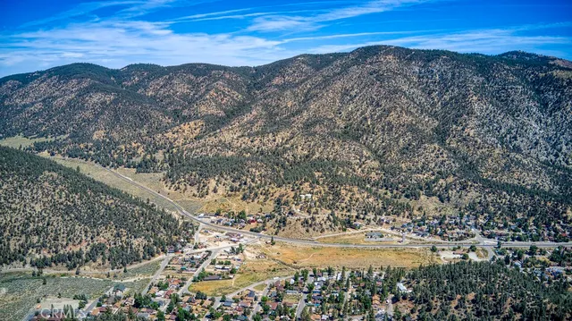a view of ocean with mountain