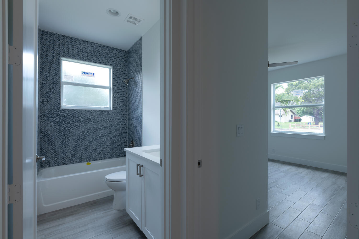 18302 Limestone Creek Road Jupiter, FL 33458 - Photo 6 of 12 a bathroom with a toilet tub and shower