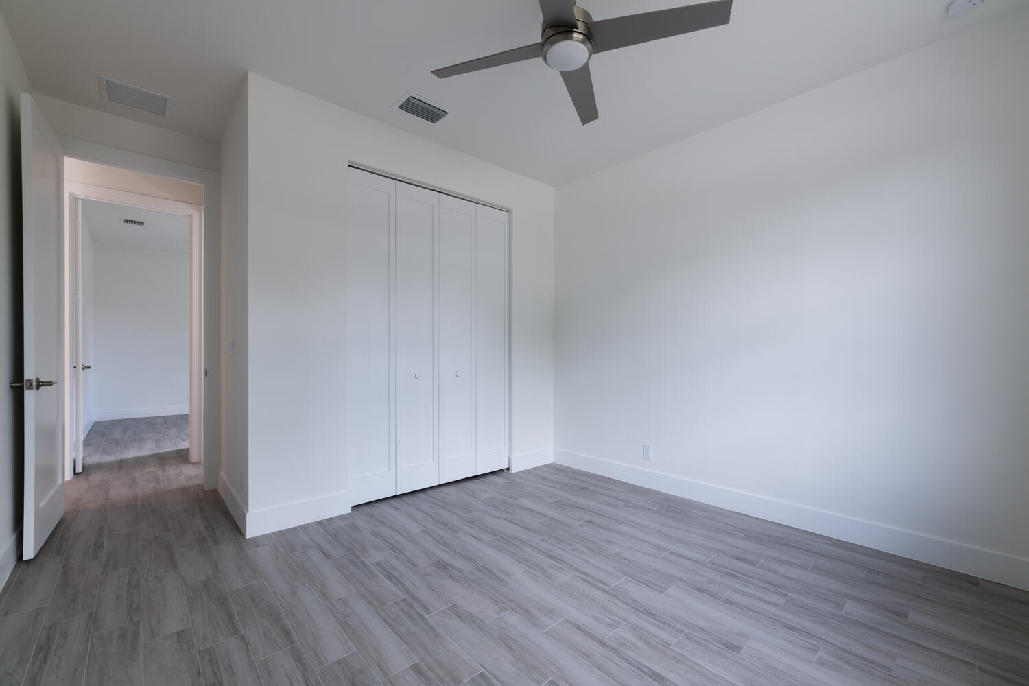 18302 Limestone Creek Road Jupiter, FL 33458 - Photo 7 of 12 a view of a room with wooden floor