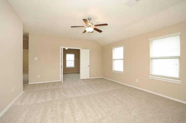 a view of an empty room with a window