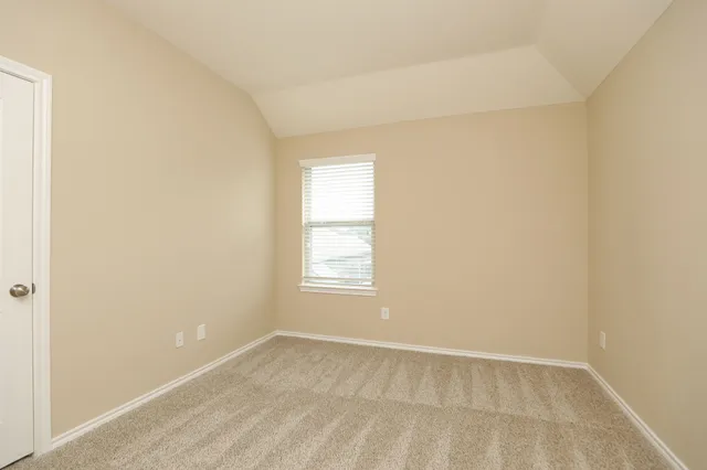 a bathroom with a bathtub shower sink mirror vanity and toilet