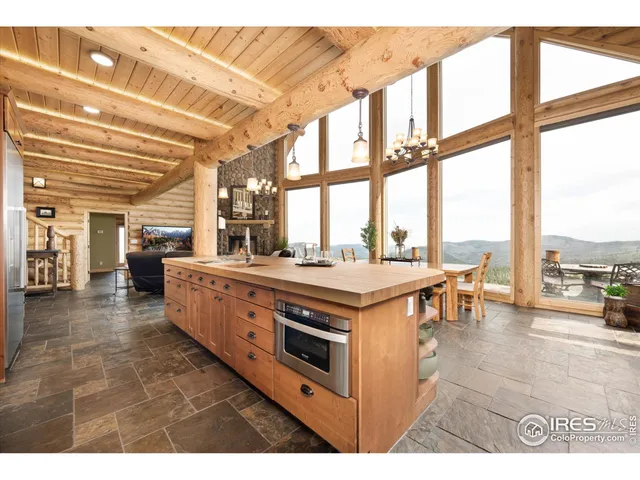 a living room with furniture and large windows