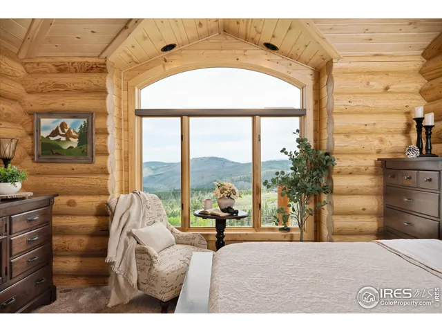 a bed room with a bed and a large window