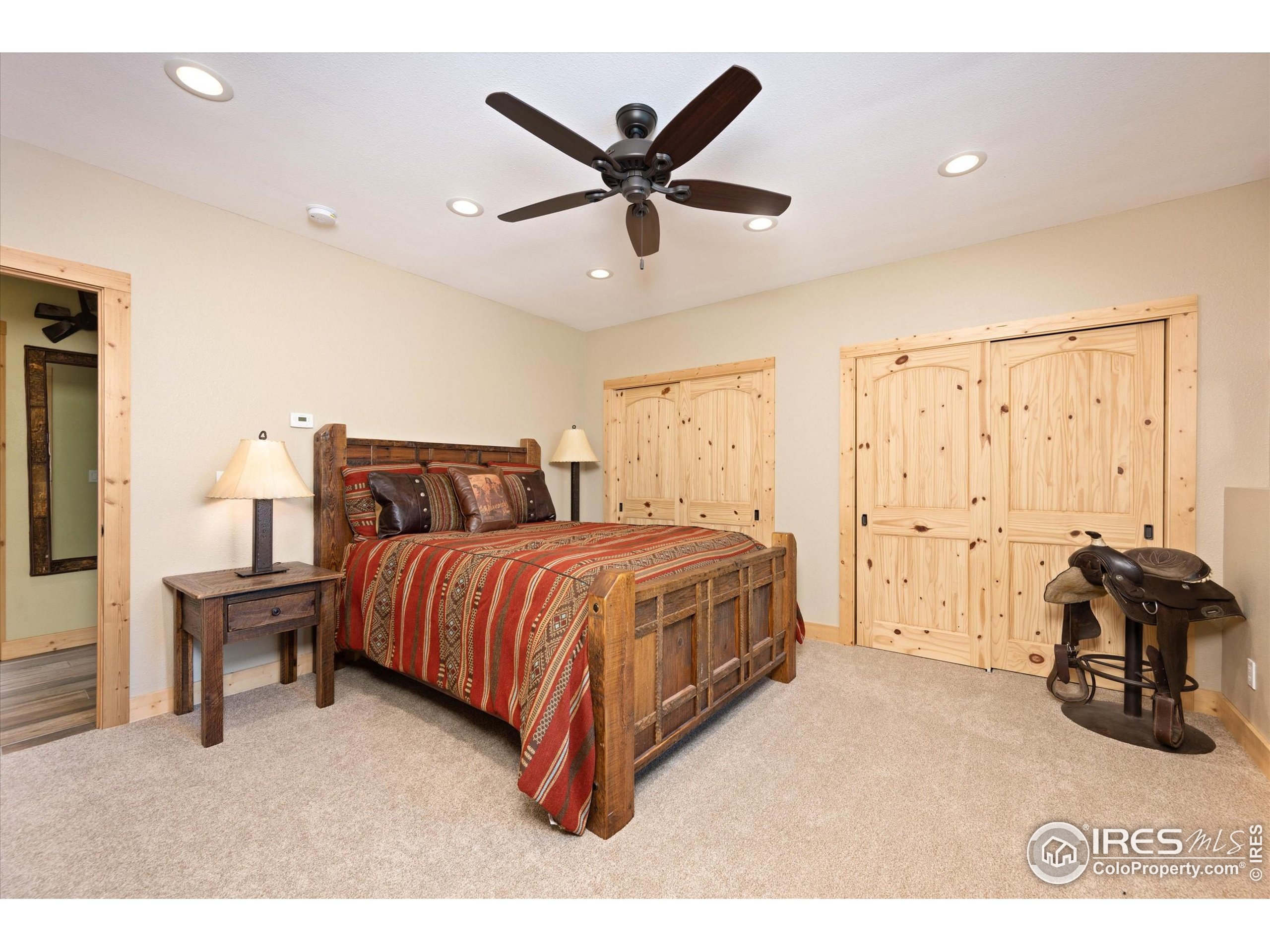 4119 Davis Ranch Road Bellvue, CO 80512 - Photo 32 of 40 a bedroom with a bed and window