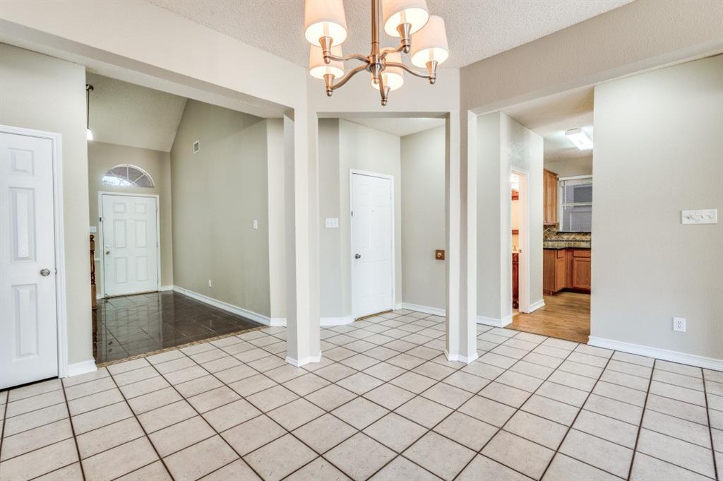 4933 Glenscape Trail Fort Worth, TX 76137 - Photo 2 of 12 an empty room with kitchen view