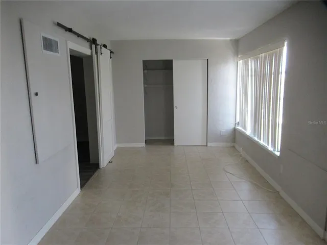 a bathroom with a granite countertop toilet a sink and bathtub