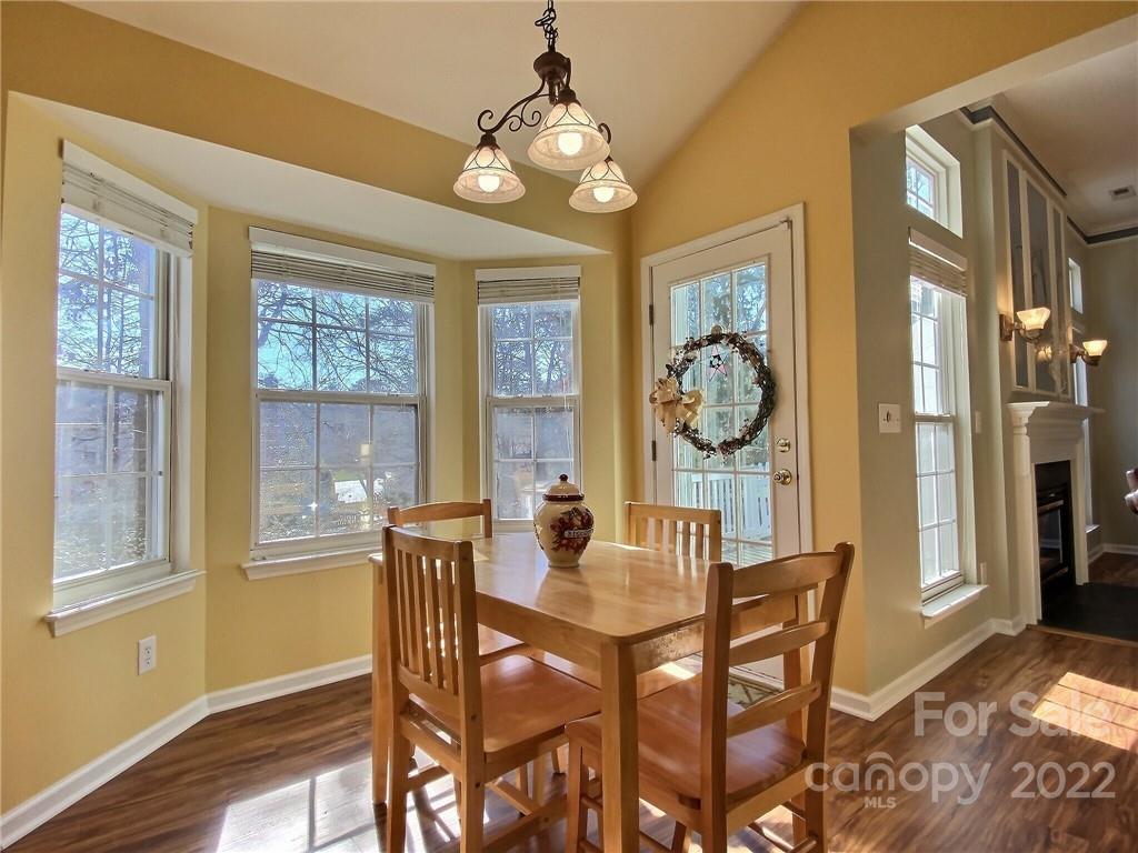 870 Knightsbridge Road Fort Mill, SC 29708 - Photo 11 of 25 a dining room with furniture a chandelier and wooden floor