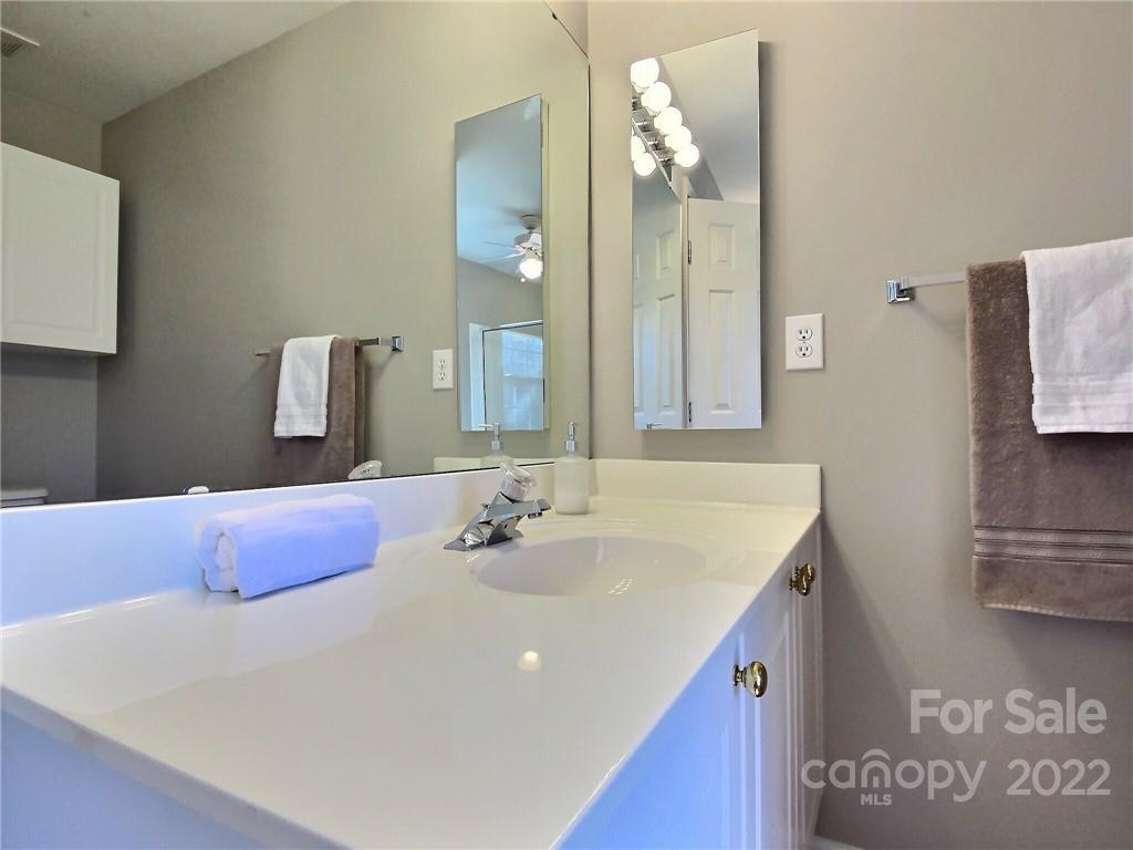 870 Knightsbridge Road Fort Mill, SC 29708 - Photo 17 of 25 a bathroom with a sink and a mirror