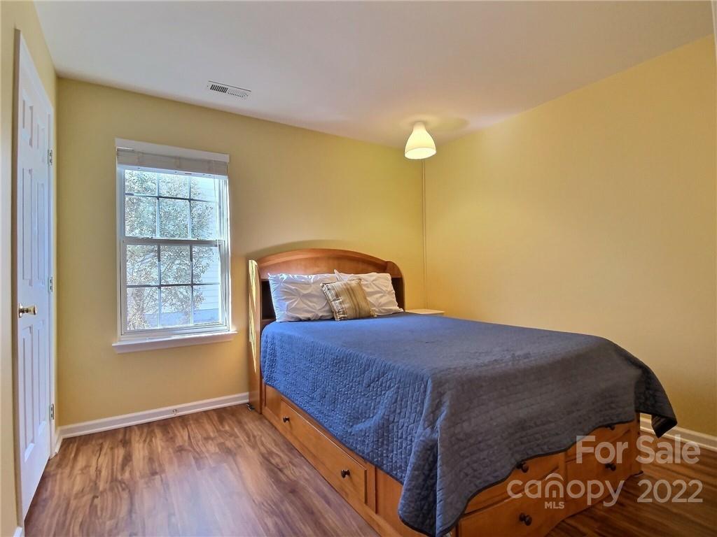 870 Knightsbridge Road Fort Mill, SC 29708 - Photo 18 of 25 a bedroom with a bed and wooden floor