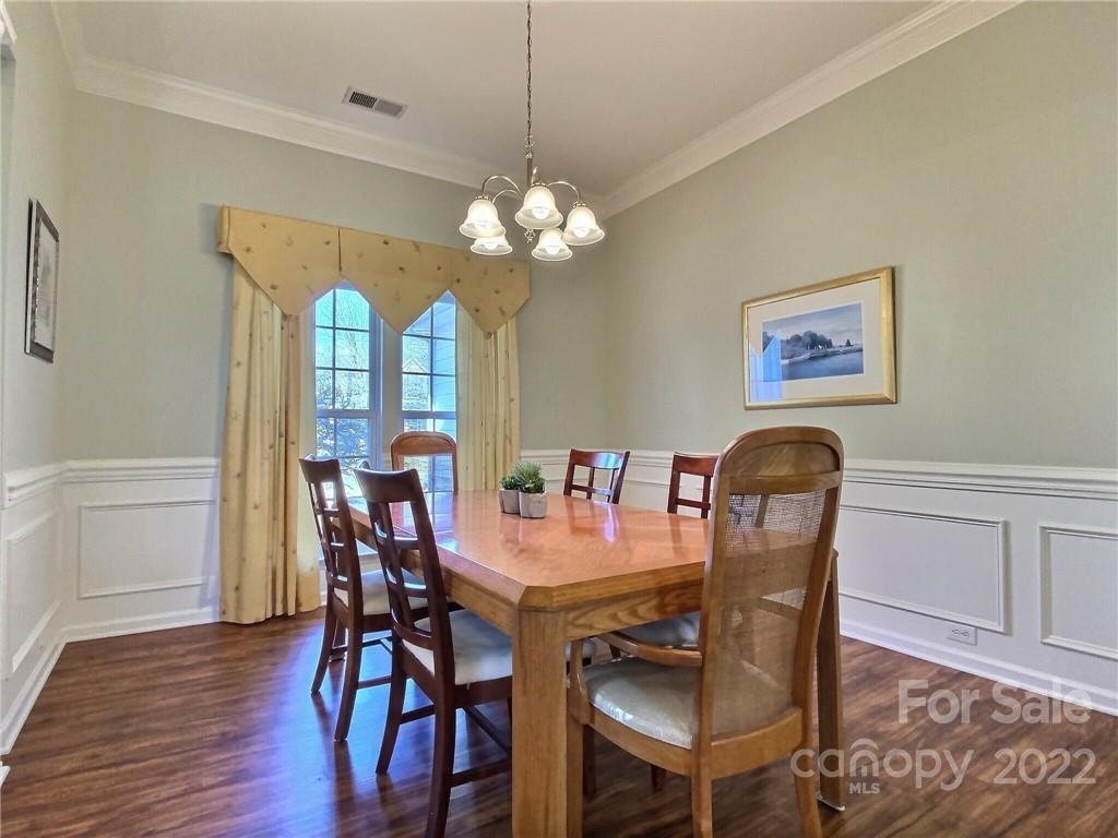 870 Knightsbridge Road Fort Mill, SC 29708 - Photo 7 of 25 a view of a dining room with furniture window and wooden floor
