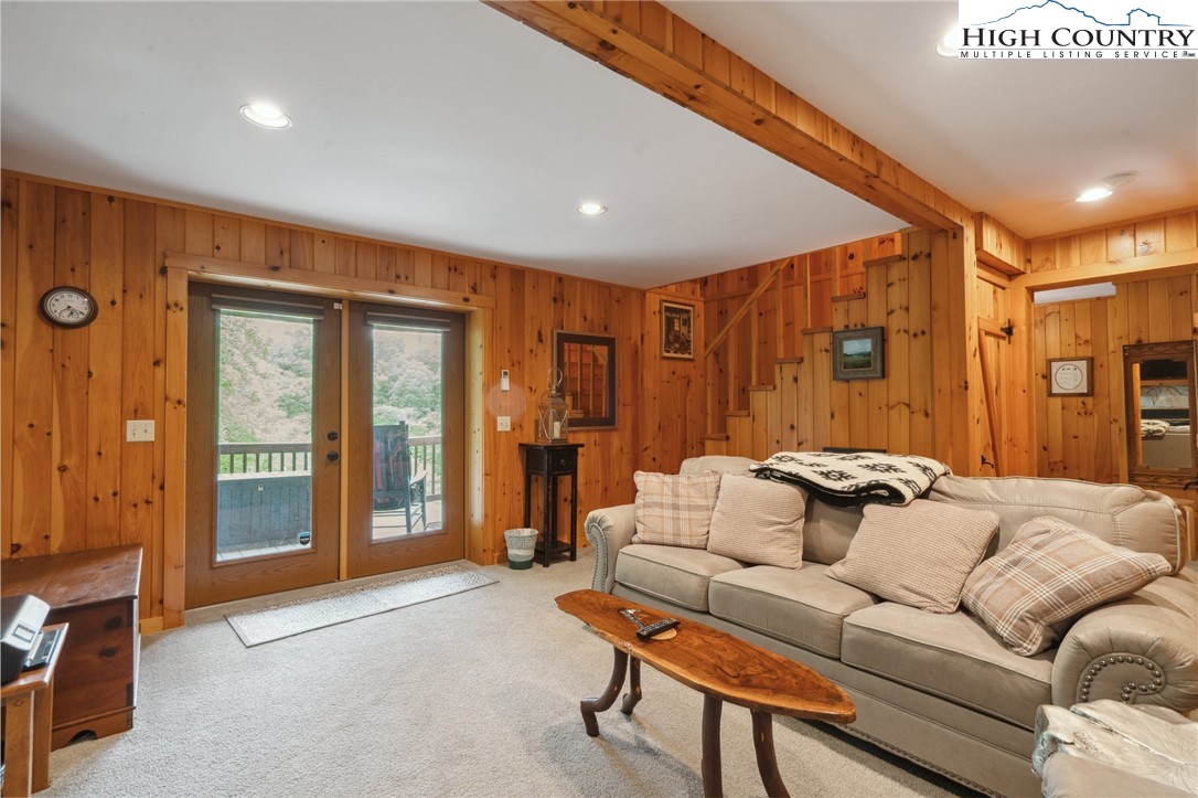 710 River Hills Road Lansing, NC 28643 - Photo 21 of 38 a living room with furniture and large windows