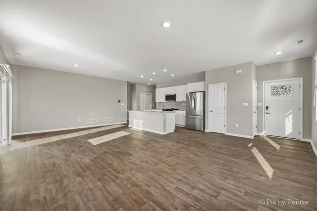 a view of a livingroom with wooden floor