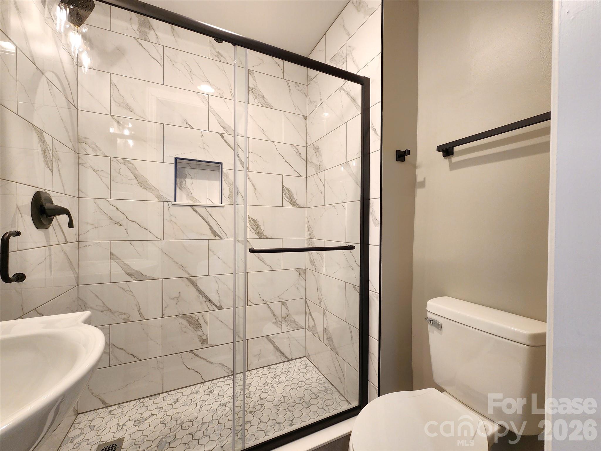 96 1/2 Elm Street Cramerton, NC 28032 - Photo 14 of 20 a bathroom with a toilet and a shower