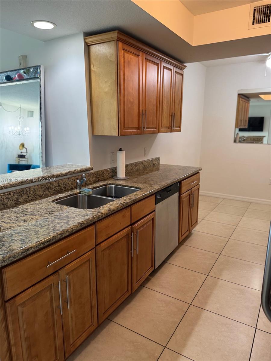 3530 Southwest 22nd Street, Unit 706 Miami, FL 33145 - Photo 5 of 18 a kitchen with a sink and cabinets