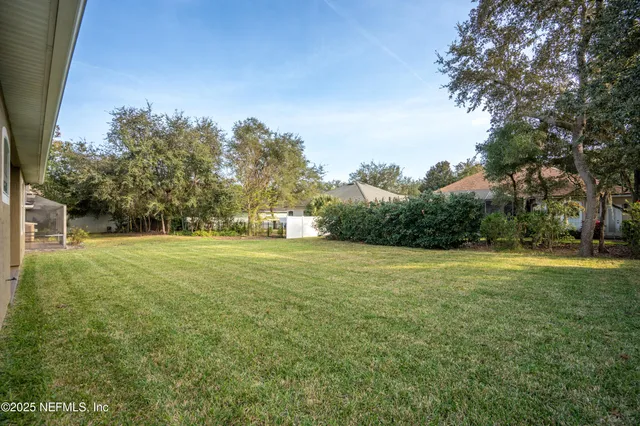 a view of field with trees in the background