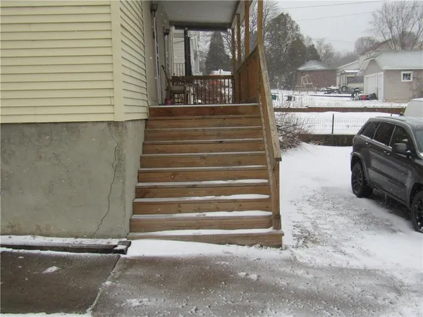 a kitchen with a refrigerator and a stove top oven
