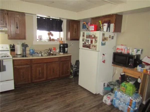 a utility room with sink dryer and washer