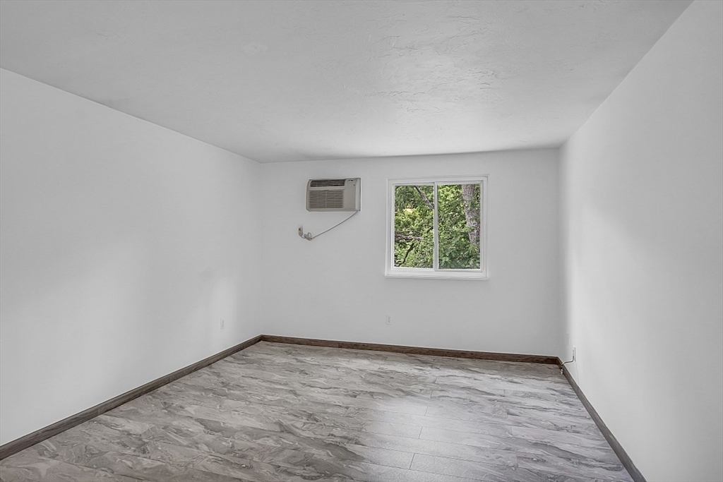 10 Mill Street, Unit B Maynard, MA 01754 - Photo 13 of 21 an empty room with a window