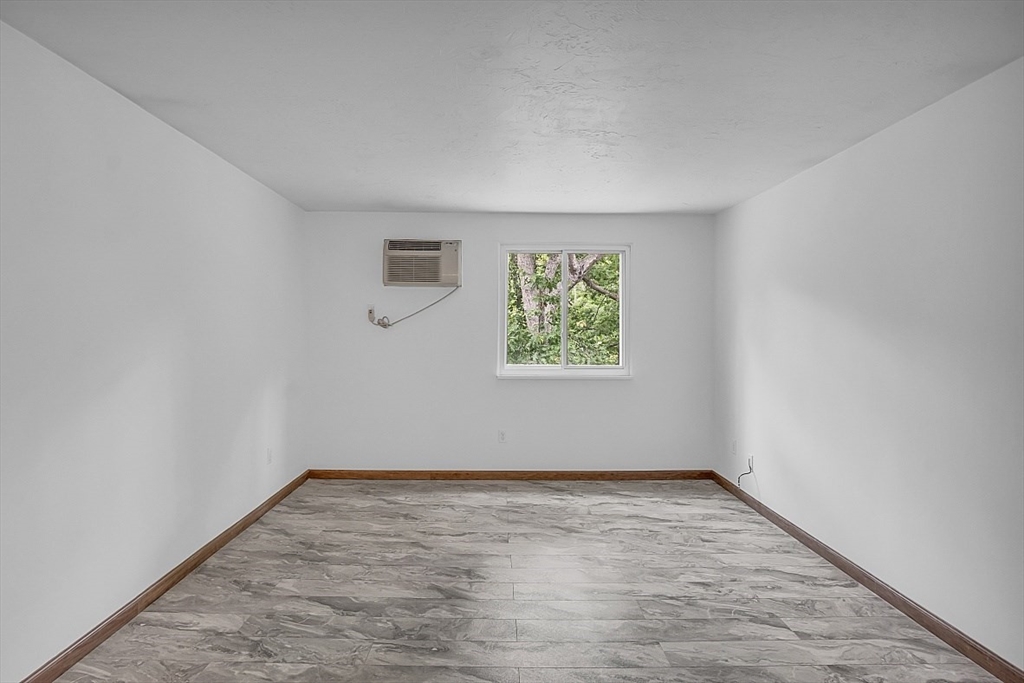 10 Mill Street, Unit B Maynard, MA 01754 - Photo 14 of 21 an empty room with a window