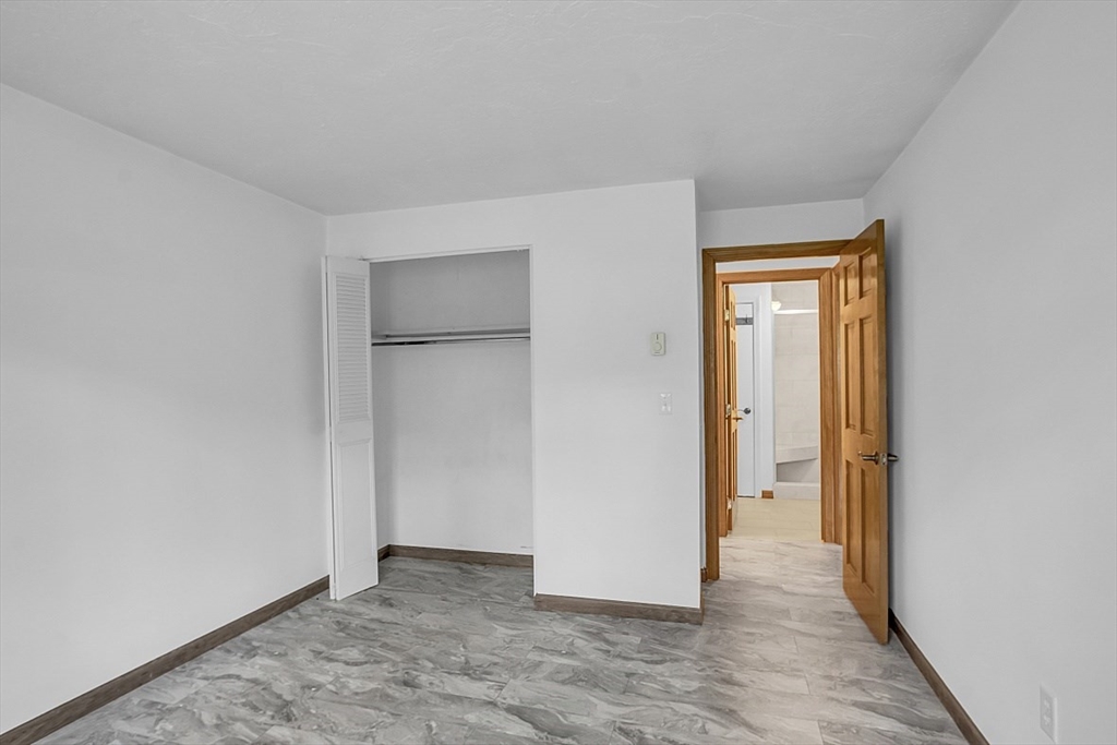 10 Mill Street, Unit B Maynard, MA 01754 - Photo 19 of 21 an empty room with closet