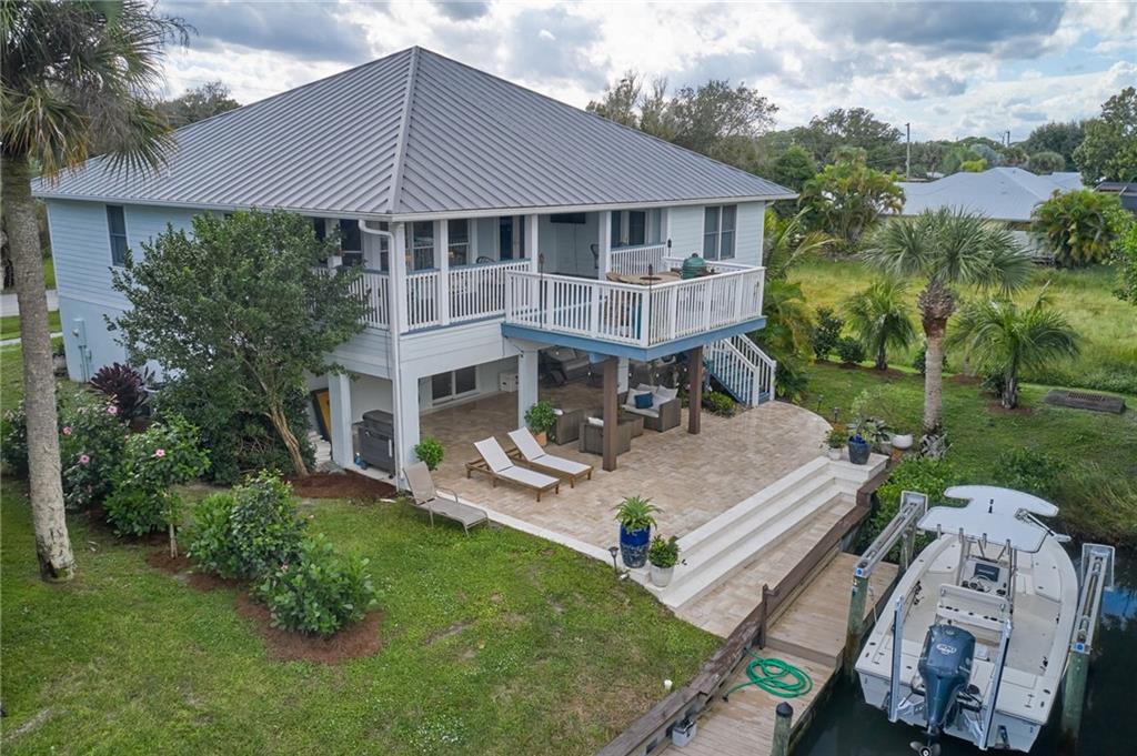 5440 95th Street Sebastian, FL 32958 - Photo 1 of 36 aerial view of a house with garden and patio