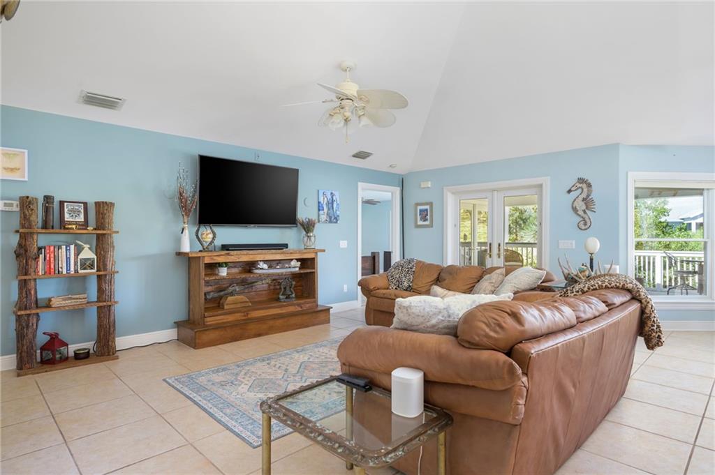 5440 95th Street Sebastian, FL 32958 - Photo 12 of 36 a living room with furniture and a flat screen tv