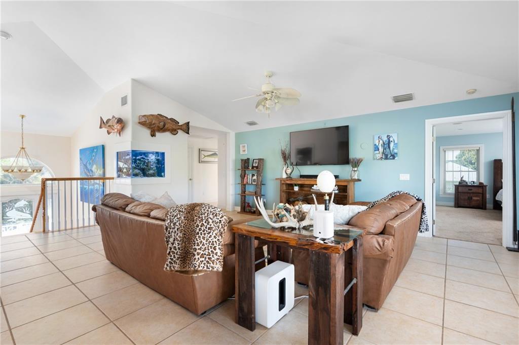 5440 95th Street Sebastian, FL 32958 - Photo 14 of 36 a living room with furniture and a flat screen tv