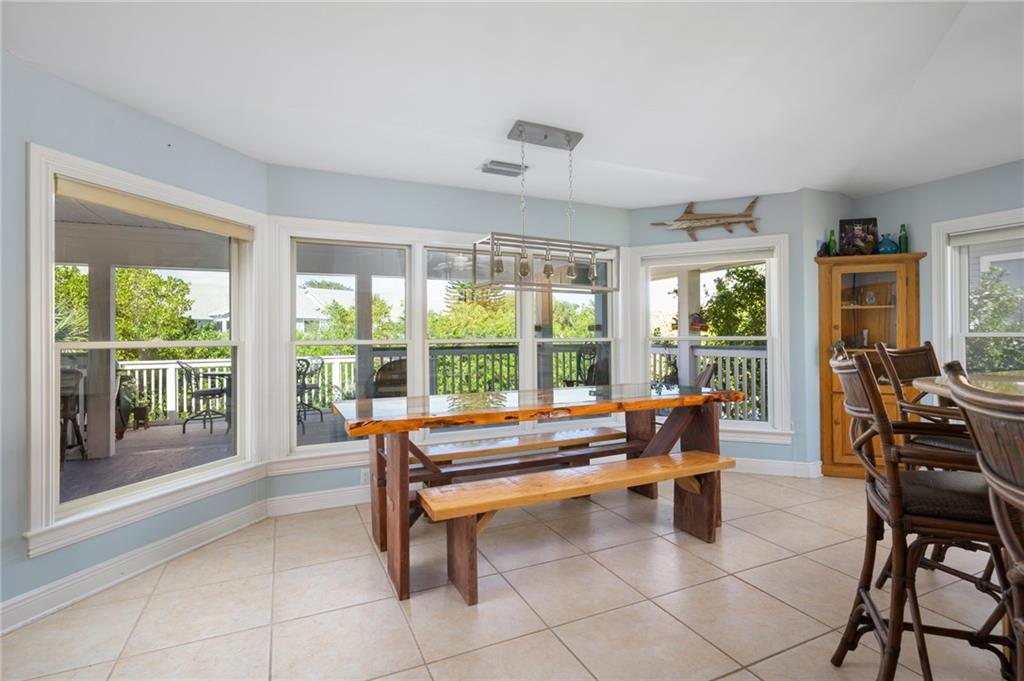 5440 95th Street Sebastian, FL 32958 - Photo 15 of 36 a living room with furniture and large windows