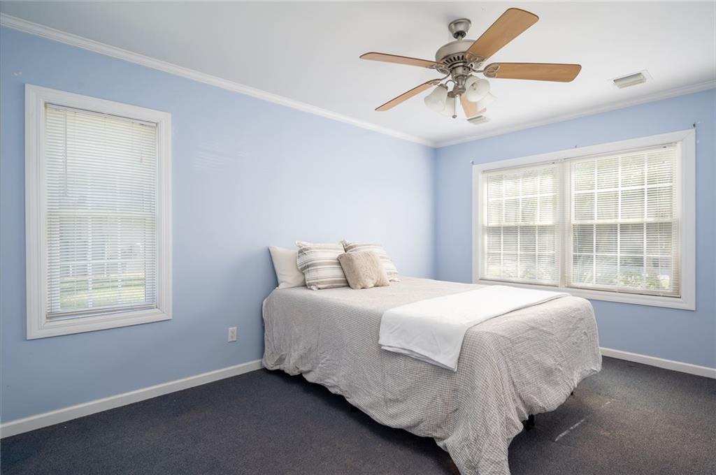 5440 95th Street Sebastian, FL 32958 - Photo 21 of 36 a bedroom with a bed and window