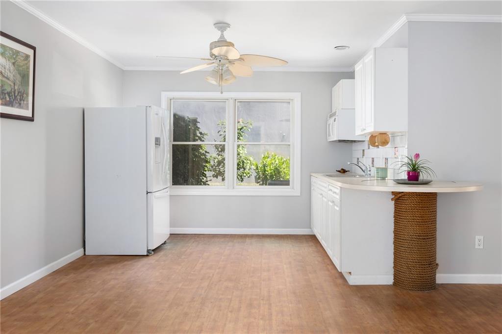 5440 95th Street Sebastian, FL 32958 - Photo 24 of 36 a view of kitchen with furniture large window and stainless steel appliances