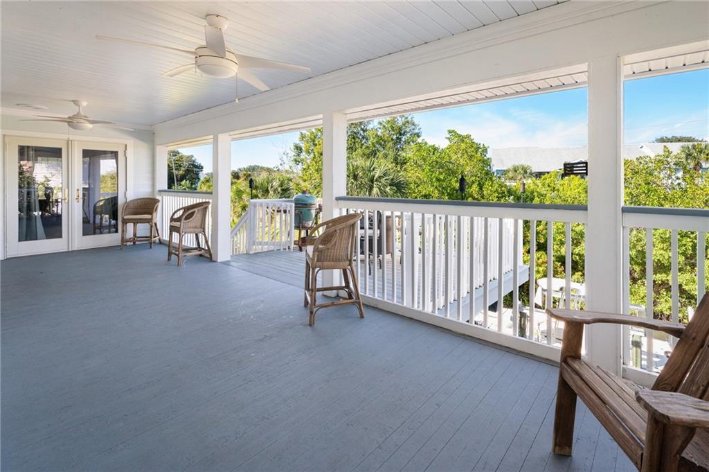5440 95th Street Sebastian, FL 32958 - Photo 25 of 36 a view of a balcony with furniture and a porch