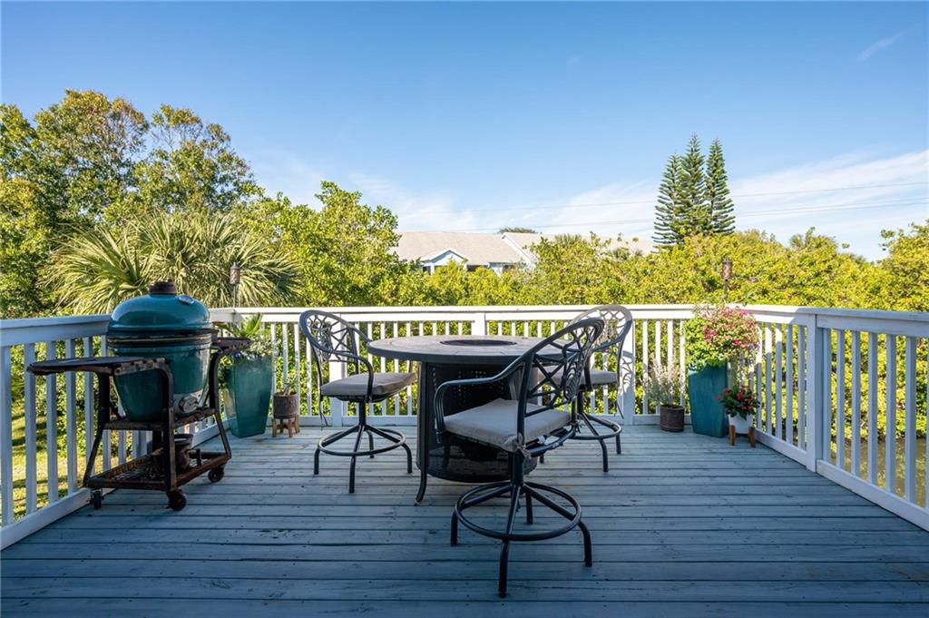 5440 95th Street Sebastian, FL 32958 - Photo 28 of 36 a view of a chairs and table on the wooden floor