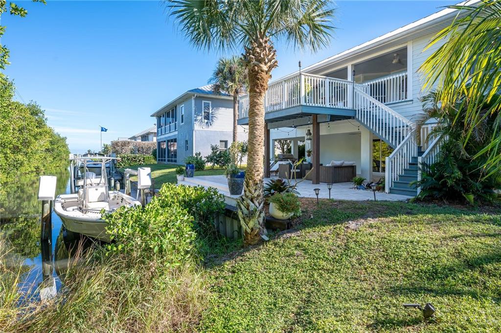 5440 95th Street Sebastian, FL 32958 - Photo 35 of 36 a front view of a house with garden and sitting area