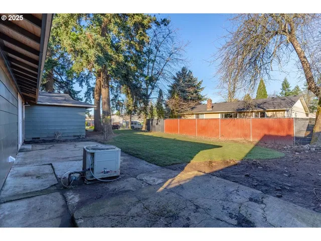 a view of a park with iron fence