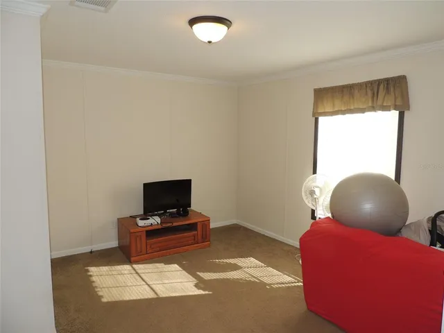 a living room with a chair and a table