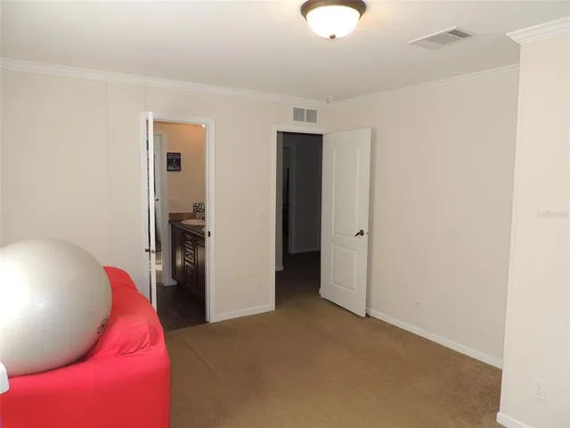 a view of a livingroom with furniture and closet