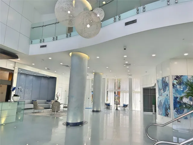 a large room with lots of table and chairs