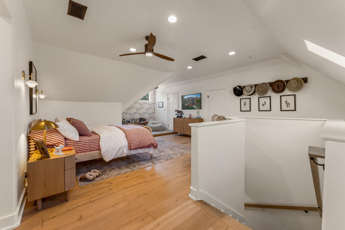 13100 Ojai Road Santa Paula, CA 93060 - Photo 32 of 60 a bedroom with bed and wooden floor