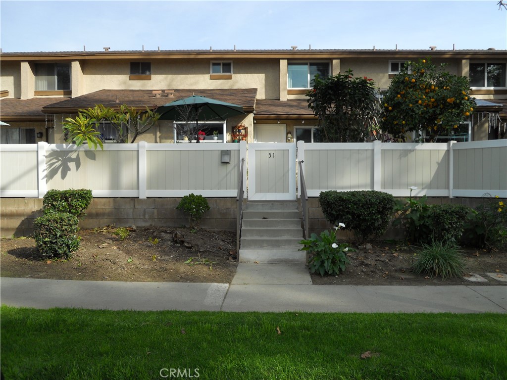 750 East 5th Street, Unit 51 Azusa, CA 91702 - Photo 1 of 59 a front view of a house with a yard