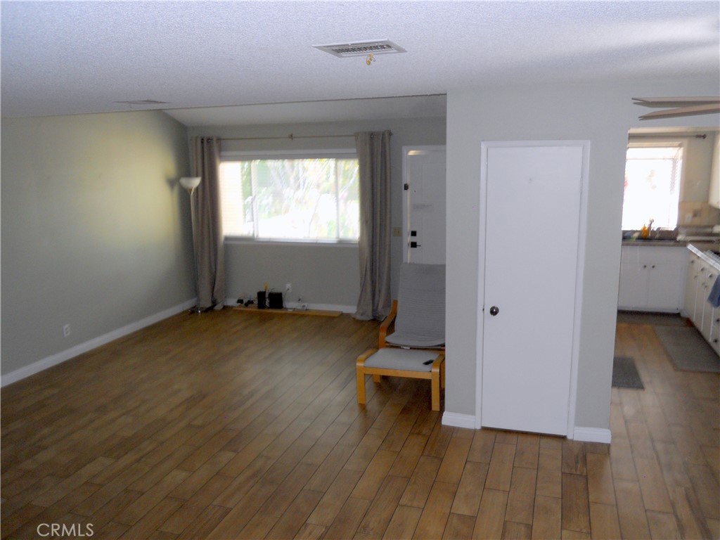 750 East 5th Street, Unit 51 Azusa, CA 91702 - Photo 11 of 59 a view of room with wooden floor and windows