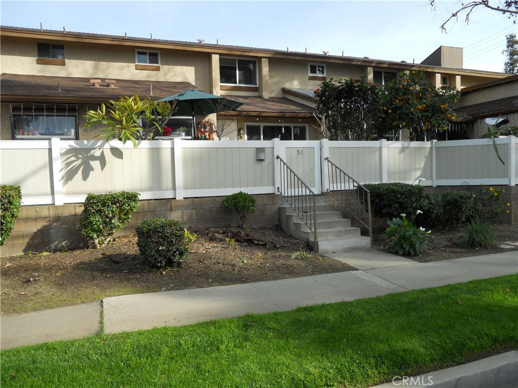 750 East 5th Street, Unit 51 Azusa, CA 91702 - Photo 2 of 59 a front view of a house with a yard