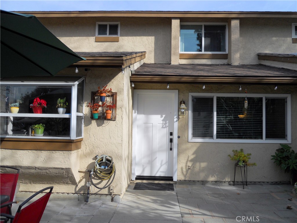 750 East 5th Street, Unit 51 Azusa, CA 91702 - Photo 23 of 59 a front view of a house with a yard