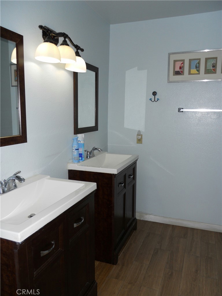 750 East 5th Street, Unit 51 Azusa, CA 91702 - Photo 29 of 59 a bathroom with a sink and a mirror