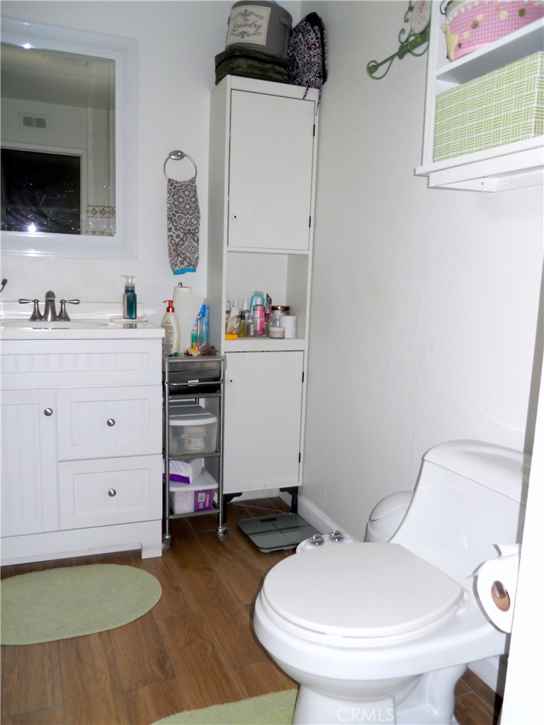 750 East 5th Street, Unit 51 Azusa, CA 91702 - Photo 32 of 59 a bathroom with a sink mirror vanity and toilet