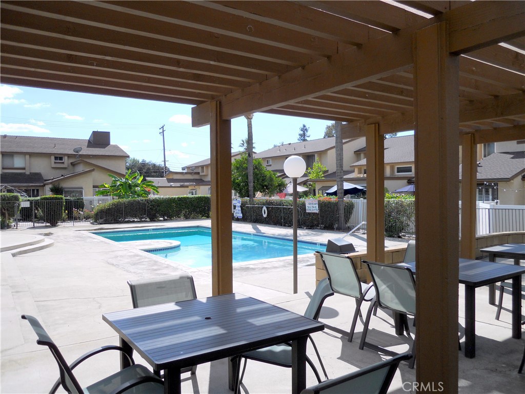 750 East 5th Street, Unit 51 Azusa, CA 91702 - Photo 41 of 59 a view of a patio with a table chairs and a patio