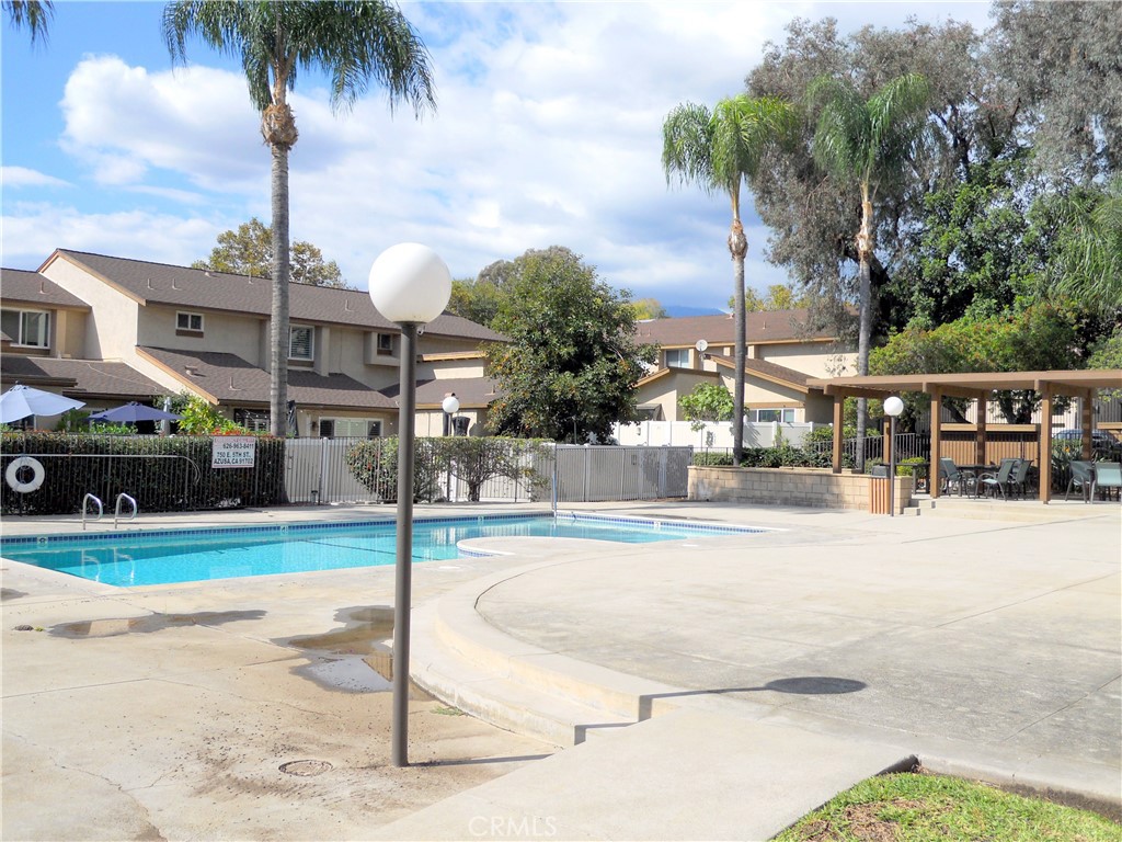 750 East 5th Street, Unit 51 Azusa, CA 91702 - Photo 43 of 59 a swimming pool with yard and outdoor seating