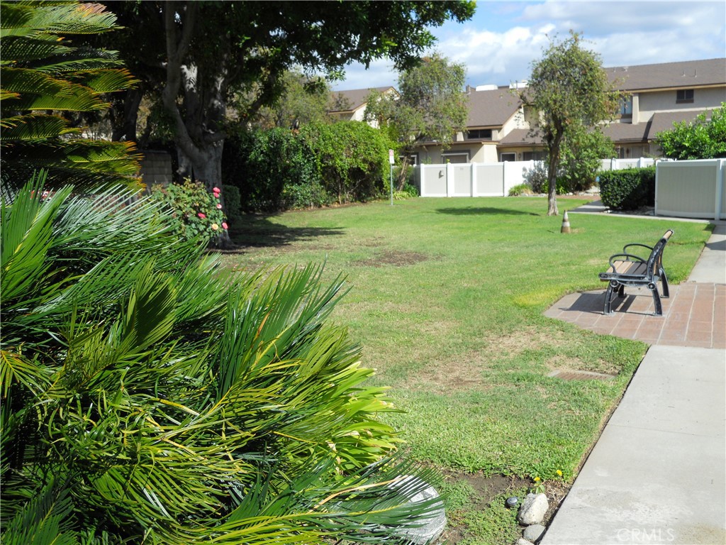 750 East 5th Street, Unit 51 Azusa, CA 91702 - Photo 48 of 59 a view of a garden with a bench