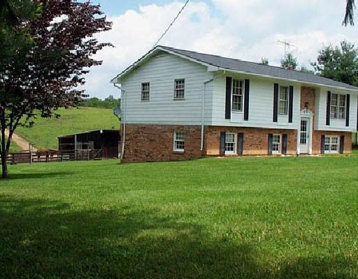 2036 Huffville Road Pilot, VA 24138 - Photo 1 of 5 a front view of a house with a garden